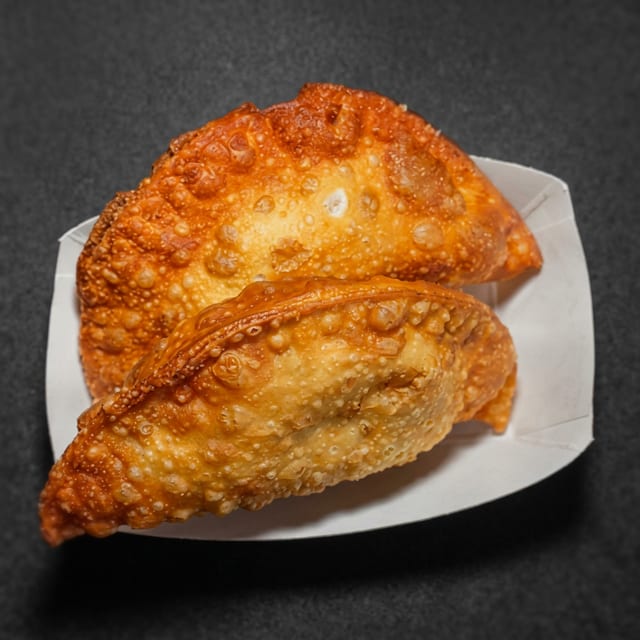 Sausage, Peppers & Onions Empanada.